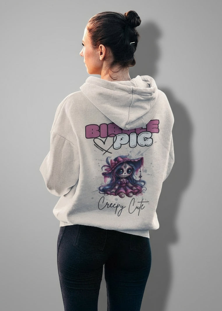 Model wearing an eco-heather organic hoodie featuring goth style creepy cute Hexberry Voodoo style graphic. 