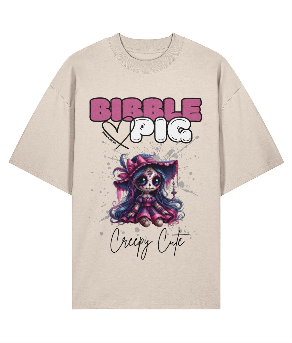 Cream oversized organic t-shirt with creepy cute voodoo doll graphic and large bibble pig logo.