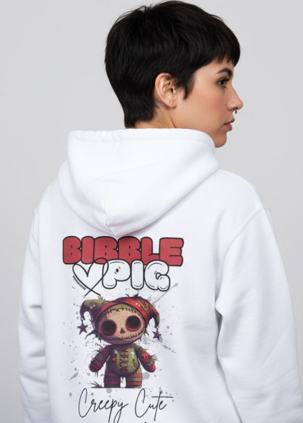 Woman wearing an organic hoodie with creepy cute voodoo doll graphic and Bibble Pig logo.