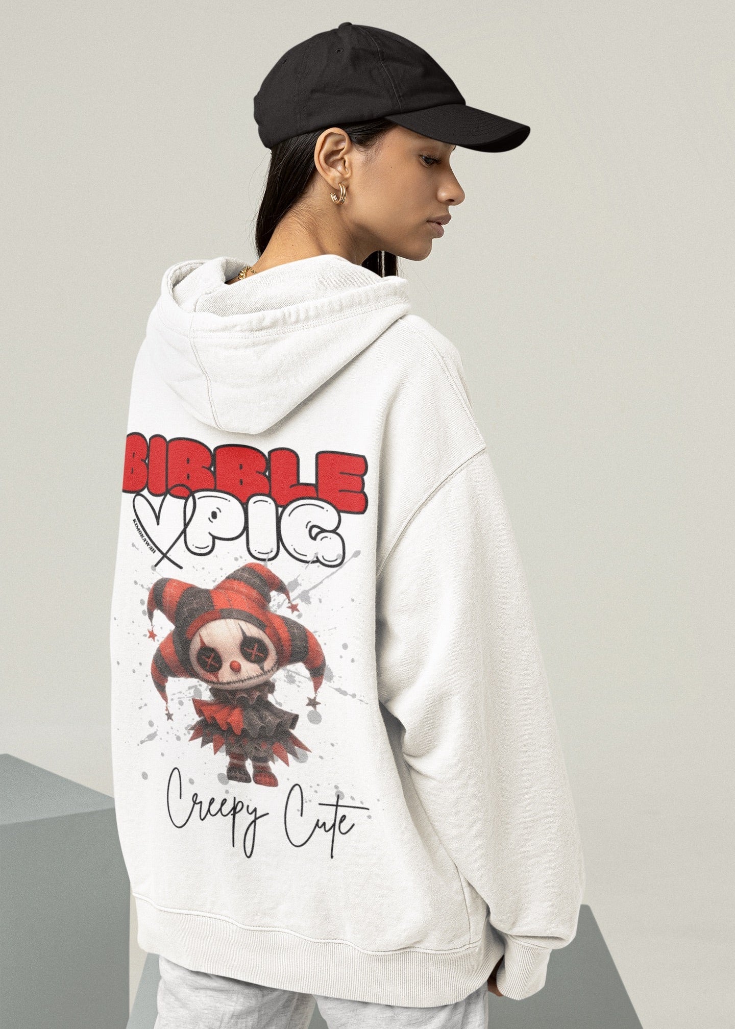 Model wearing a white organic hoodie featuring goth style creepy cute Luna Jester Voodoo style graphic.  
