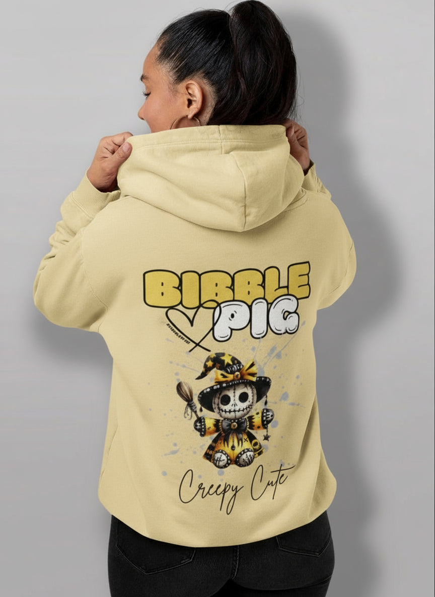 Model wearing a yellow organic hoodie featuring goth style creepy cute Soul Keeper Voodoo style graphic. 