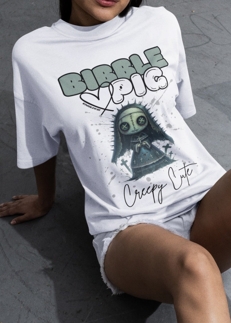 Close up of model wearing white oversized t-shirt featuring Nightshade Nun Voodoo doll graphic and bold Bibble Pig Logo.   