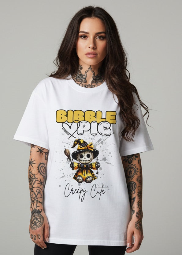 Model wearing a white oversized organic t-shirt with bold voodoo doll graphic and large Bibble Pig logo. Creepy Cute aesthetic for Kimokawaii fashion.